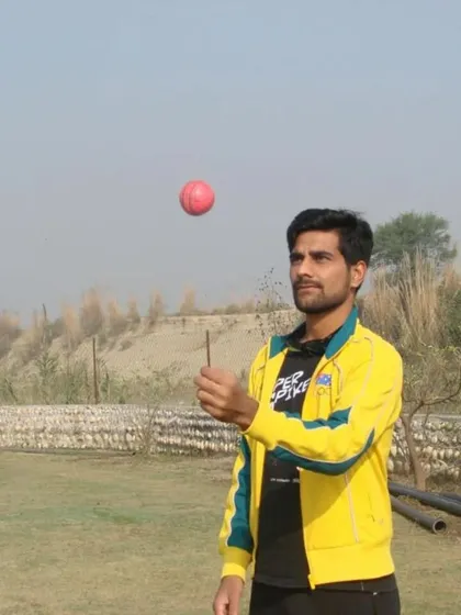 A spinner tossing the ball during practice. We teach the subtle arts of flight, dip, and turn, helping our spin bowlers become potent weapons in any match.