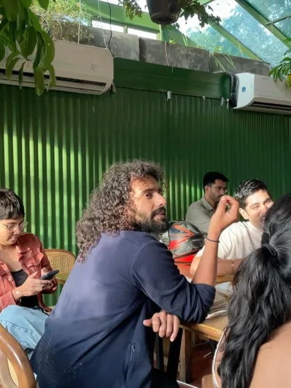 An engaged participant at our chocolate workshop. We encourage an interactive atmosphere where guests can chat with the experts and fellow attendees, making each session a communal experience.