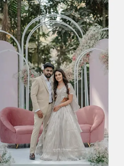 For this modern garden engagement, I created a chic and romantic backdrop. The setup features soft pastel florals, contemporary white arches, and a plush pink sofa, making it the perfect photo-ready spot for the happy couple.