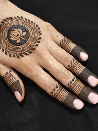 A beautiful lotus mandala design with detailed finger work.