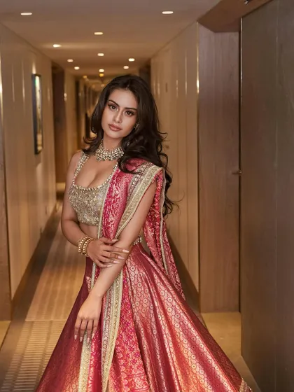 A full-length portrait that captures the complete regal elegance of this traditional yet modern wedding guest look.