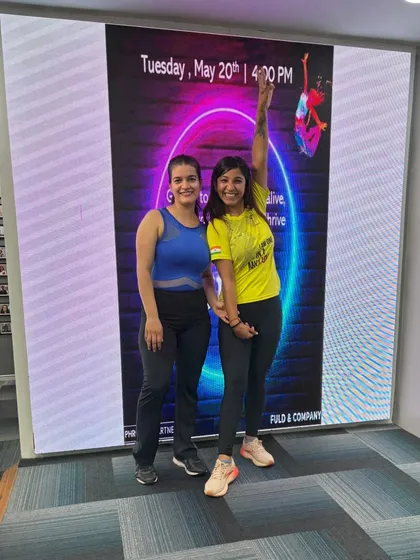 Posing with my awesome partner after a super successful session at Phronesis Partners. Collaboration is key to delivering the best corporate wellness experiences.