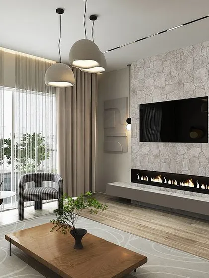 The TV wall in the Japandi room includes a floating console with an integrated modern fireplace, set against a textured stone-like finish.