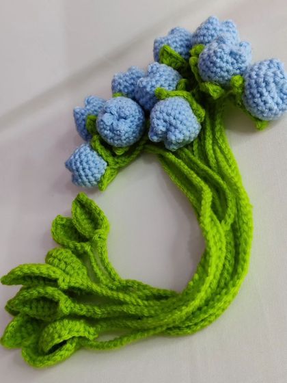 A bundle of light blue tulip bookmarks.