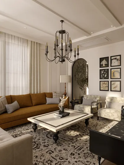 Another angle of this sophisticated living room, showing the interplay of light and shadow. The classic chandelier and wall moldings add a layer of traditional elegance, while the modern furniture keeps the space feeling current.