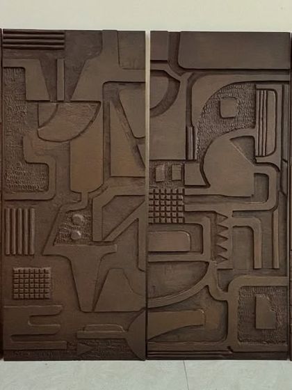 This set of four wooden art panels was a custom project for a home in Jaipur. Each panel features intricate, carved abstract patterns, creating a cohesive and sophisticated gallery wall with a rustic, modern feel.