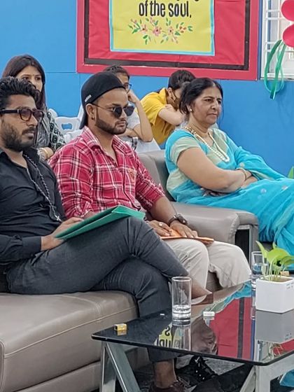 Judging a dance event, focused on the performances. It's inspiring to see so much passion from the participants.