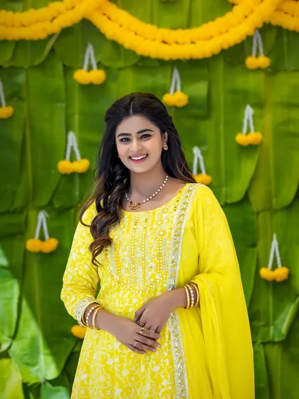 A lovely portrait of Inchara Joshi. Her simple, elegant makeup and soft curls create a look that is both youthful and timeless.
