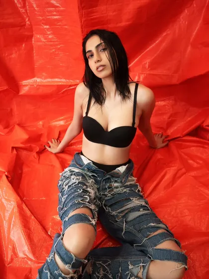 A direct, confrontational pose from the same edgy series. The simple, bold background keeps all the attention on the model and her attitude.