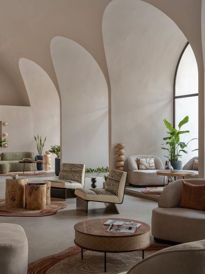 This wide shot captures the overall atmosphere of the "Vaultz's Up" lounge. It's a vibrant fusion of color, texture, and material that enchants the senses at every glance.