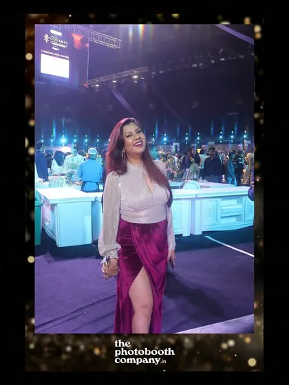 A guest looking radiant at the gourmet food festival. Our professional lighting ensures everyone looks fantastic in their photos.