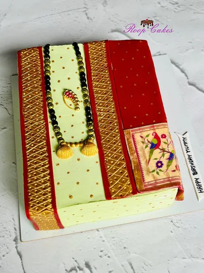I love bringing unique ideas to life, like this cake designed to look like a traditional Paithani saree. The intricate details, from the golden border to the edible mangalsutra and nath, are all handcrafted to honor our beautiful culture.