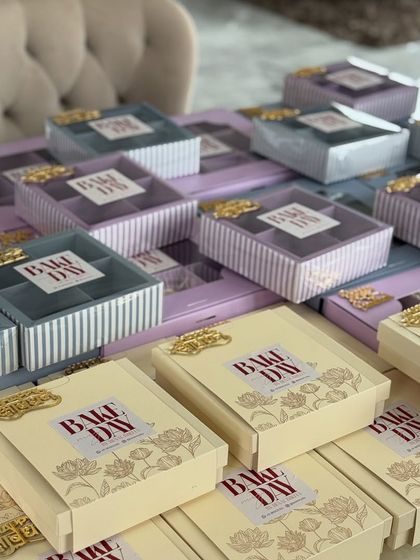 Stacks of our beautiful Rakhi dessert boxes ready to be filled with assorted brownies and other treats for bulk orders.