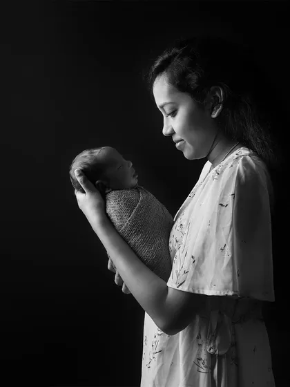 A black and white version of a mother and child portrait, which adds a timeless and classic feel. This editing style is available for any of the parent poses.