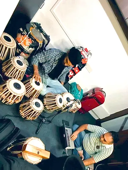 Gearing up for a concert in Jaipur. Here we are setting up all the instruments, including my large set of tablas for the show.
