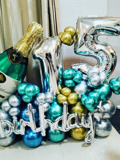 I also make custom balloon bouquets for delivery. This one for a 15th birthday includes number foils, a champagne bottle foil, and a mix of chrome balloons.