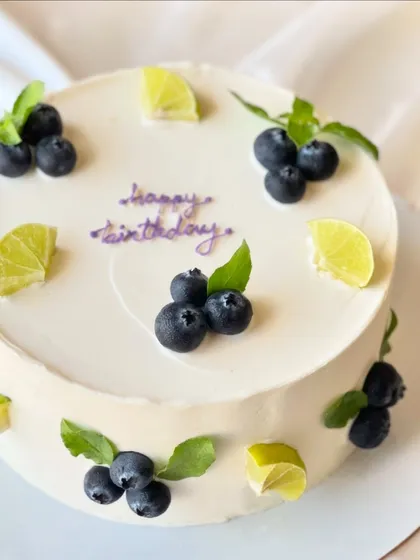 My most popular creation, the signature Italian Lemon & Blueberry cake. I offer many design variations, all featuring fresh blueberries, zesty lime, and smooth buttercream.