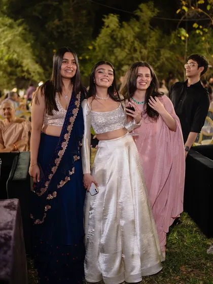 The bride's tribe enjoying the sangeet. We help coordinate looks for the entire group of friends and family, creating a visually harmonious and stylish celebration.