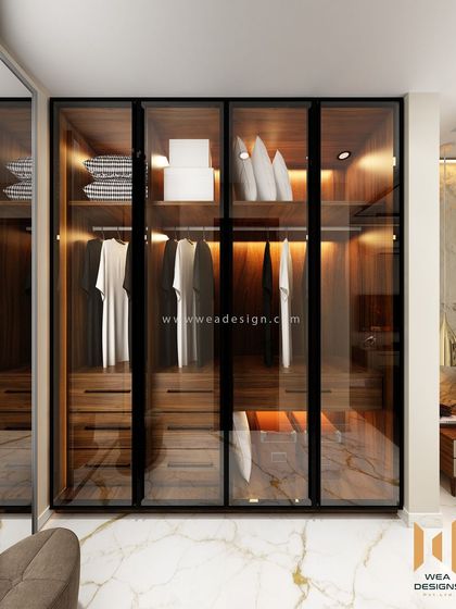 The walk-in closet area of the master bedroom, with premium tinted glass wardrobes that are both functional and stylish.