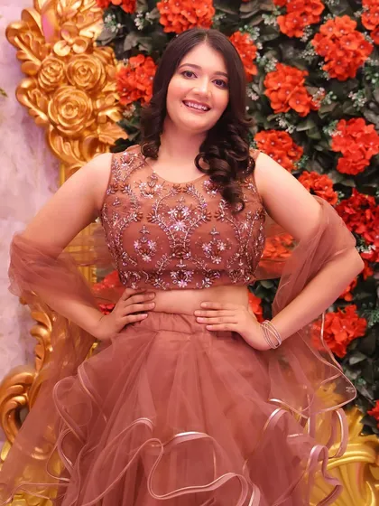 A happy and confident party-goer. The makeup is fresh and radiant, letting her personality shine.
