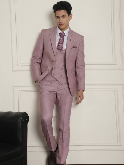 Summer occasion wear calls for pastel colors. This three-piece suit in a lovely pastel pink is perfect for going from a day to an evening event.