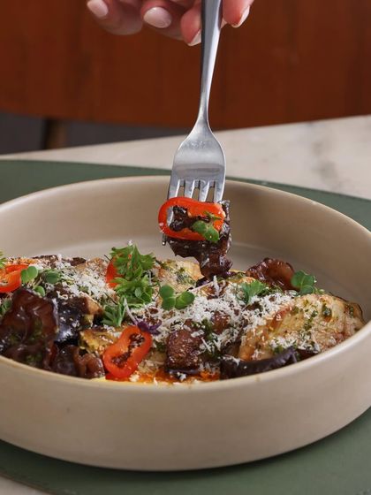 A forkful of our Chargrilled Exotic Mushrooms, showing the different types of mushrooms and the creamy emulsion.