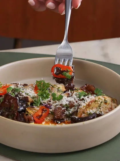 A forkful of our Chargrilled Exotic Mushrooms, showing the different types of mushrooms and the creamy emulsion.