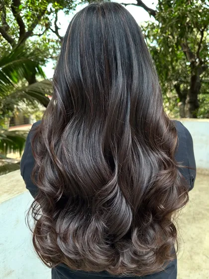 Her first hair color, and we went with a beautiful 'Cocoa Bean' shade. This is a great choice for a first-timer, as it's a subtle, rich brown that enhances natural hair color without being too dramatic.
