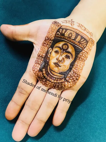 A portrait of the goddess Vitthal, with 'Aai Mauli' written above. This is a deeply personal and spiritual design for devotees.