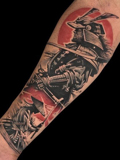 A powerful Japanese samurai tattoo with a bold red sun background, symbolizing honor, resilience, and the warrior spirit.