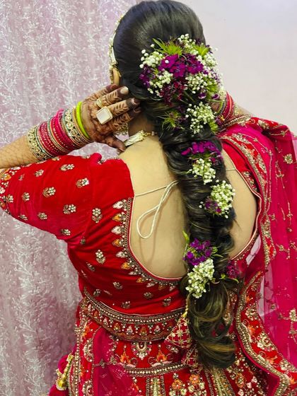A close-up of the floral braid, showing the texture and the placement of each flower.