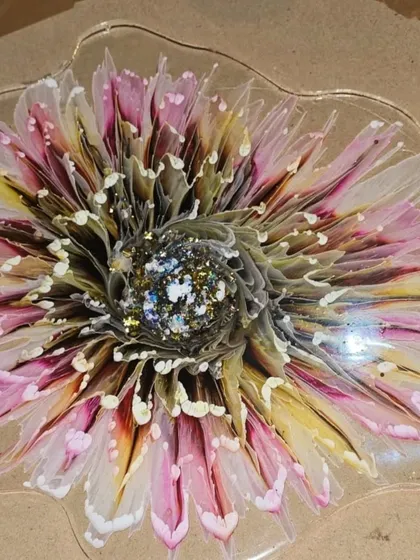 This intricate 3D flower with a sparkling center was made in my workshop. You can learn to create these detailed and beautiful floral pieces with my guidance.