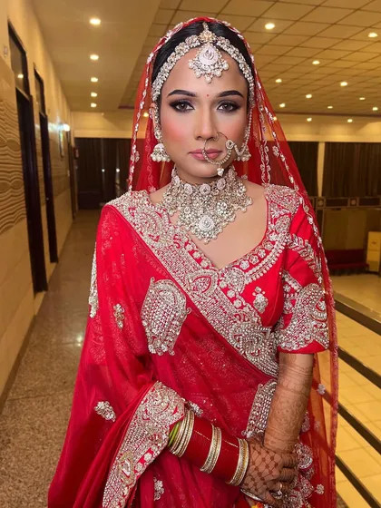 The same bridal look, but in a cooler, white light. This lighting brings out the true tones of the makeup and outfit, showing the versatility of the look.