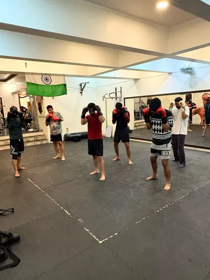 The calm before the storm. A group of students listens to instructions, ready to begin their striking drills for the day.