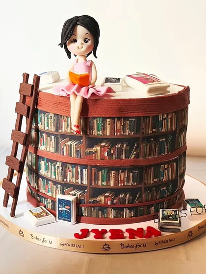 Another angle of the library cake, showing the incredible detail of the edible bookshelves and the handcrafted fondant accessories.
