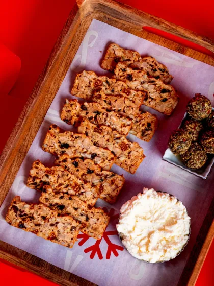 Our Fruit 'N' Nut Crisps served on a festive tray with creamy Fromage Blanc and Chèvre Truffle cheese.