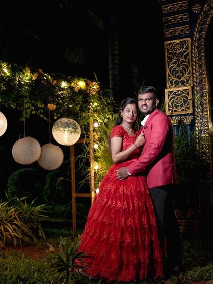 A beautiful night-time shot with hanging paper lanterns and fairy lights, creating a festive and magical atmosphere.