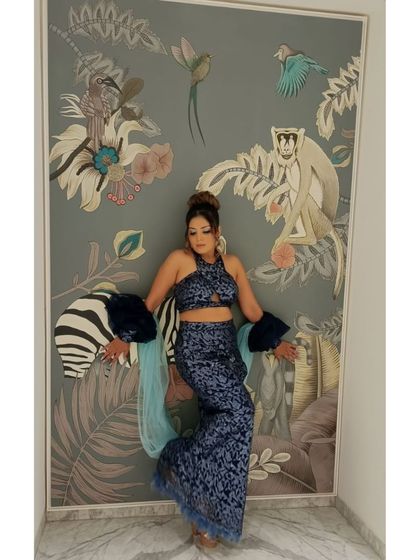 Our makeup not only looks great up close but also in professional photos. This client is posing after her makeover, showcasing how our application ensures you are camera-ready from every angle.