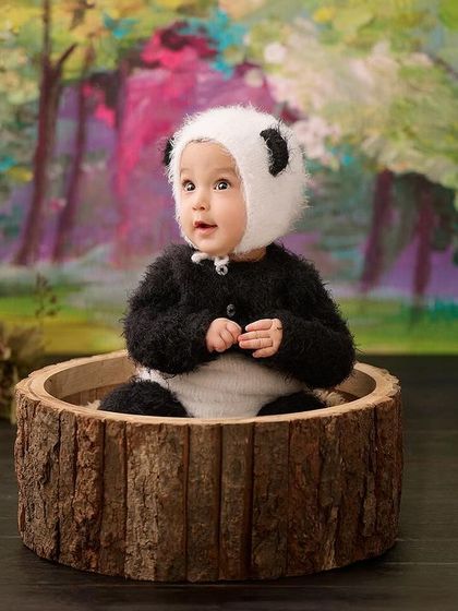 We can't handle the cuteness of this little panda. Our animal-themed shoots are always a joy, bringing out the playful side of every baby.
