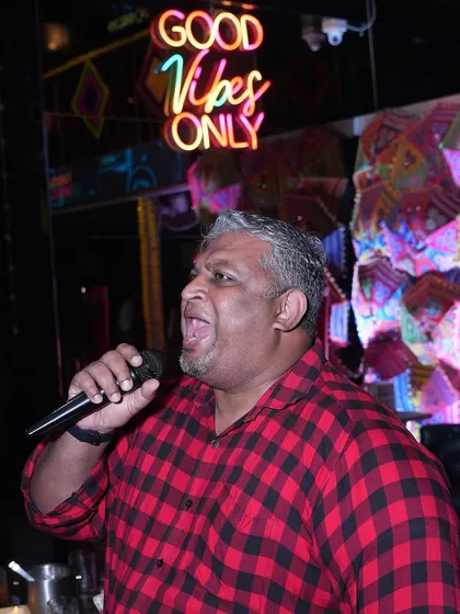 This guest is giving it his all on the mic. The energy is just as high for the singers as it is for the dancers.