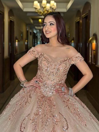 A beautiful portrait of a client in the rose-gold ball gown. Her smile captures the joy of feeling like a princess, which is the experience I aim to provide with every rental.