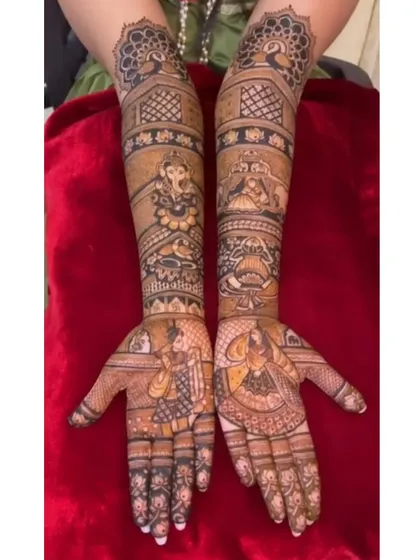 A full bridal set combining portraits of the bride and groom with figures of Lord Ganesha and other deities, surrounded by peacock and traditional patterns.