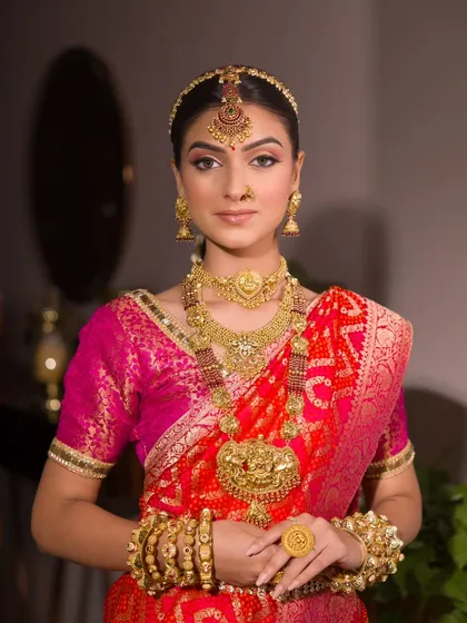 A tribute to tradition and grace. I have a special love for creating the South Indian bridal look, focusing on classic elements like temple jewellery, a traditional saree, and makeup that feels both divine and authentic.