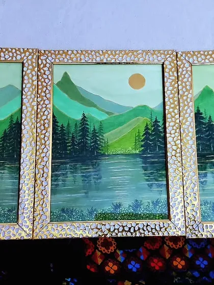 This is my triptych acrylic painting, "The Divine Nature," beautifully framed and ready to bring tranquility to a new home. This set of three paintings on A4 sheets creates a continuous, serene landscape of mountains and water.