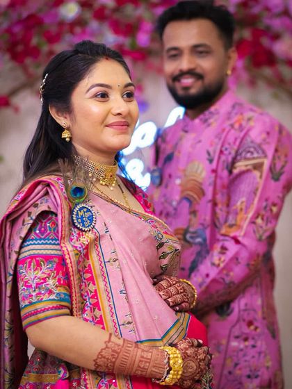 A candid shot from the baby shower, focusing on the mother-to-be's glowing look. Her colorful outfit, rented for the occasion, is both traditional and celebratory.