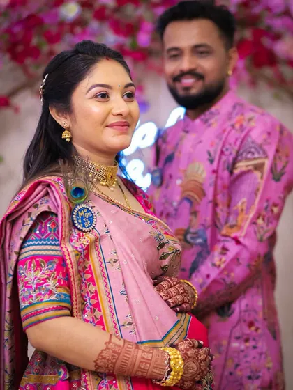 Another sweet moment from the baby shower, with the mom-to-be looking radiant in her rented outfit.