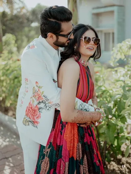 A sweet, candid moment with the groom hugging the bride from behind. These natural, unposed shots are often the most beautiful.