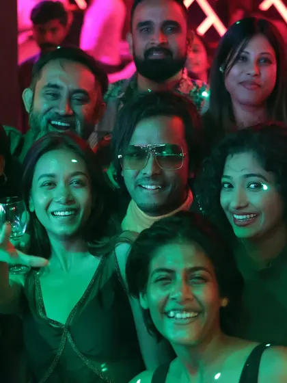A group photo capturing the pure joy and good vibes of the crowd at the Mirror Nightclub launch event.