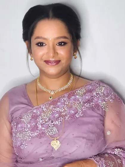 Jebha's reception makeover. She opted for a lovely lavender saree, and we paired it with a soft, elegant makeup look and a classic updo.
