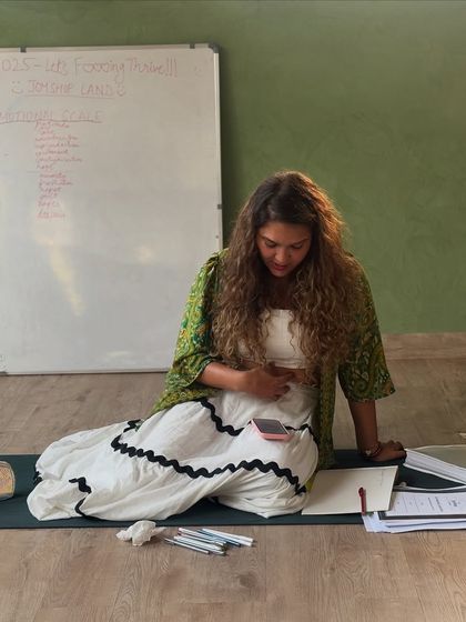 Our guide, Aahana, preparing for the manifestation and journaling workshop. She creates a sacred space where belief feels safe and magic feels real.